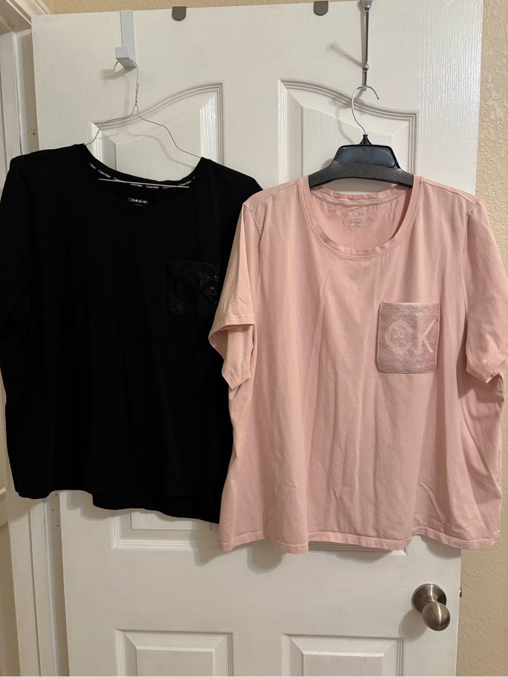 Calvin Klein women’s Pink & black Short-Sleeve Tees with sequin Pocket Logos